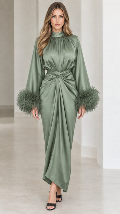 Sage green satin evening gown featuring draped knot waist and feather cuffs