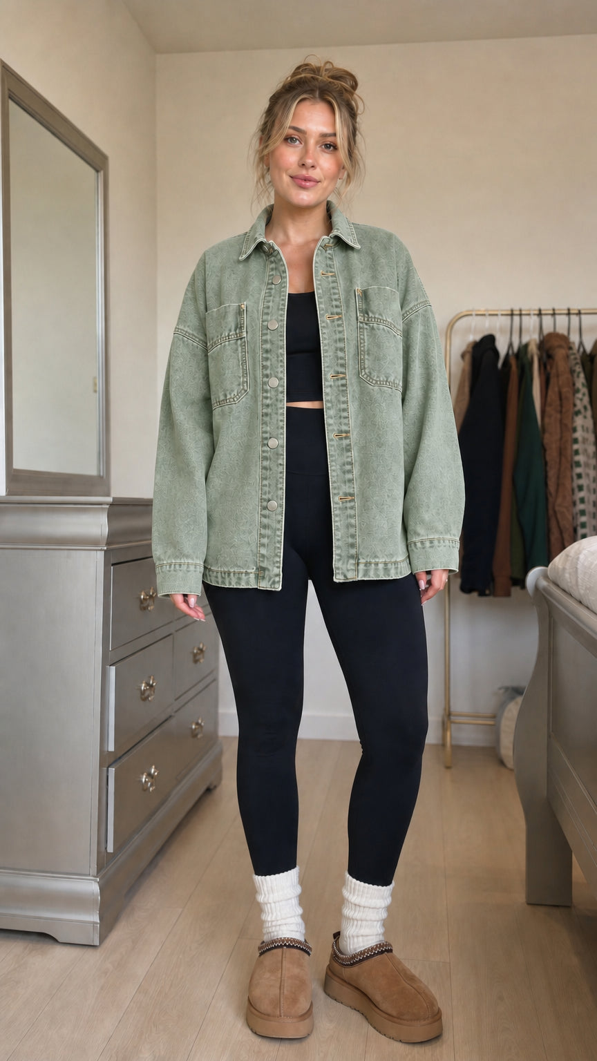 Front view of model wearing sage green denim shacket