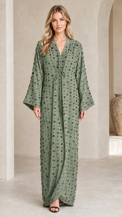 Front view of woman wearing Sage Green long-sleeve embellished abaya dress