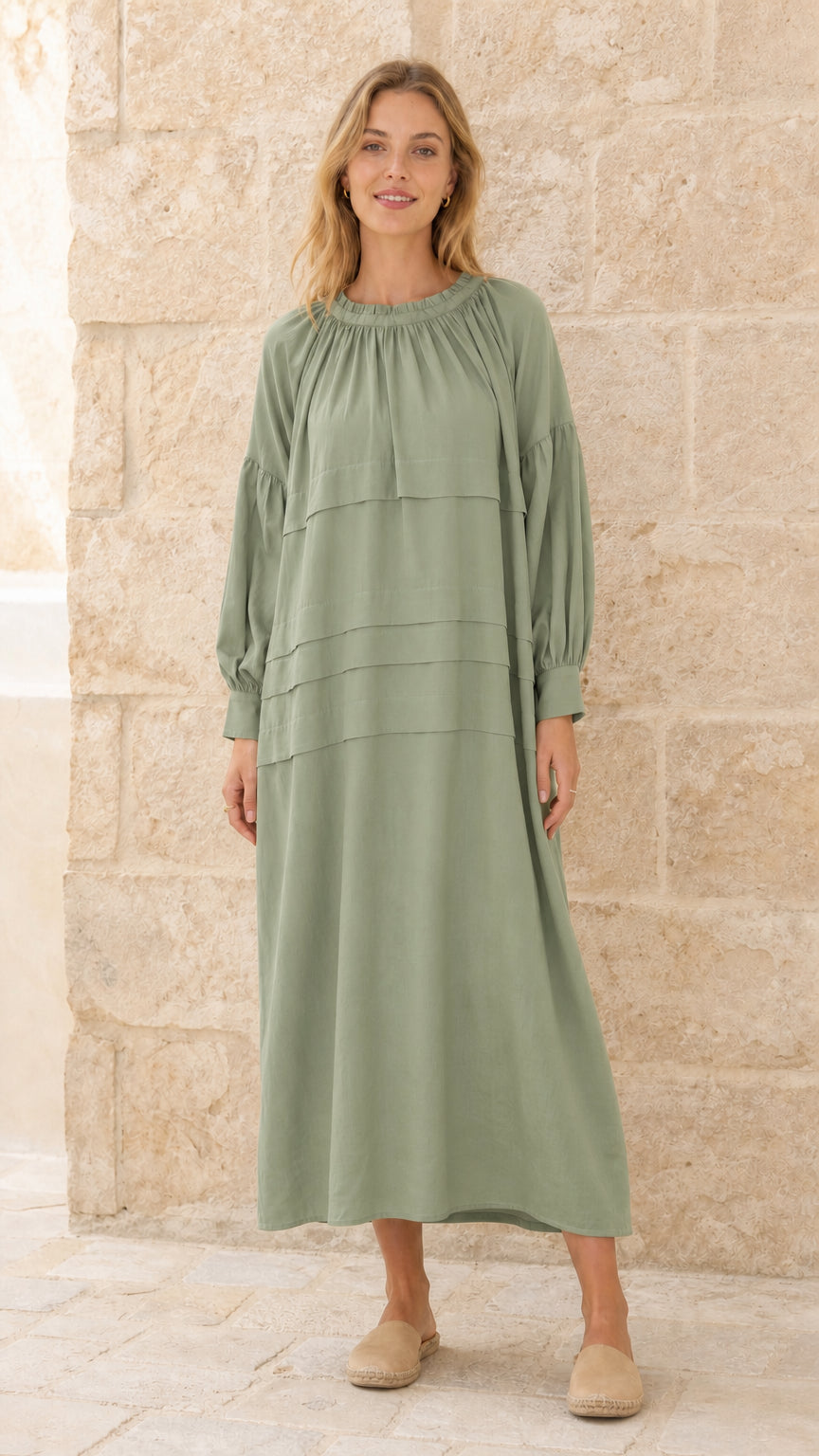 Full front view of model wearing sage green tiered maxi dress