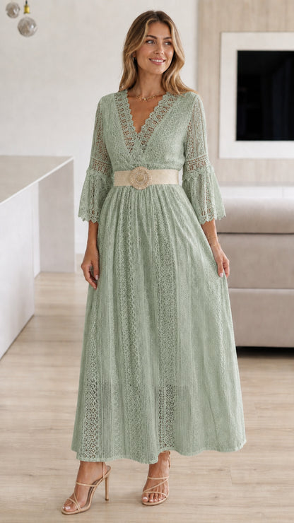 Model wearing sage green lace maxi dress with woven belt