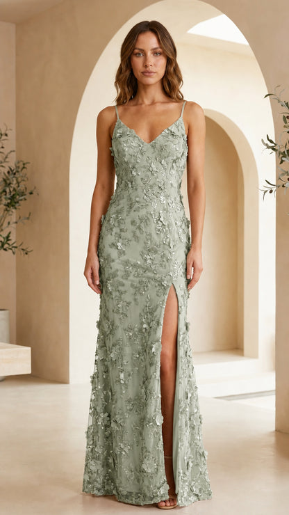 Model wearing sage green 3D floral applique evening gown with leg slit