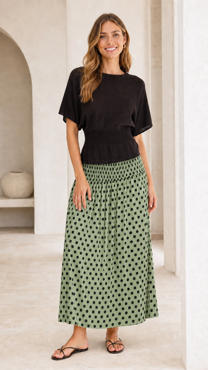 Front view of two-tone short sleeve maxi dress with sage green polka dot skirt