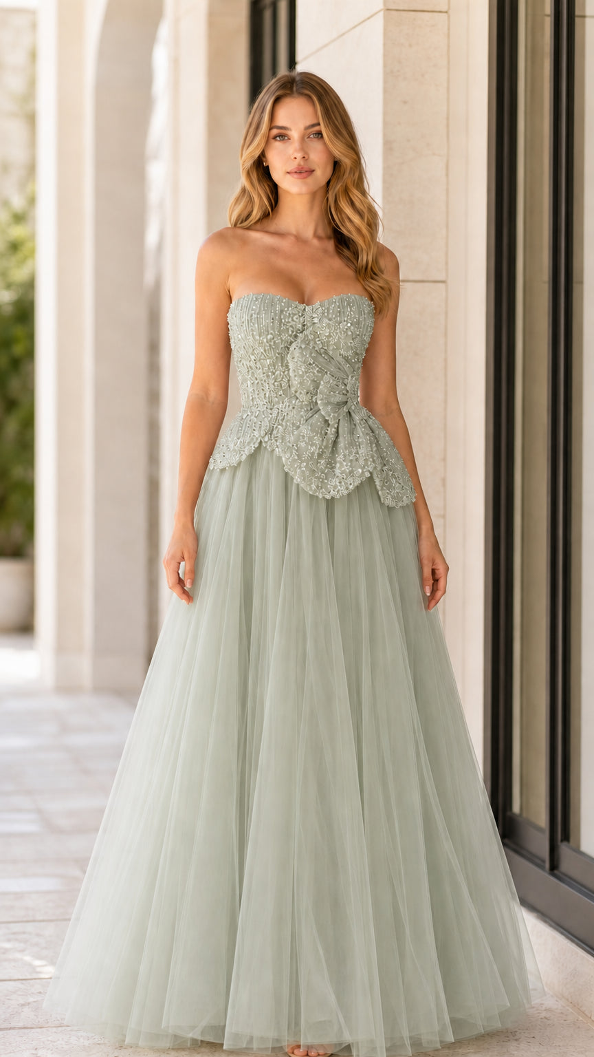 Front full-length view of sage green strapless beaded tulle formal dress