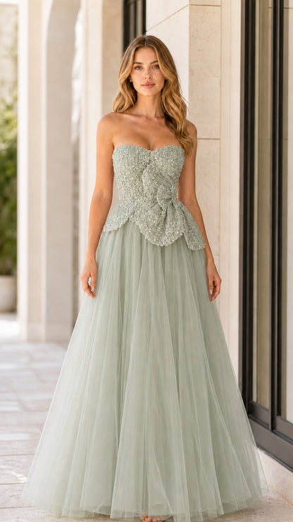 Front full-length view of sage green strapless beaded tulle formal dress