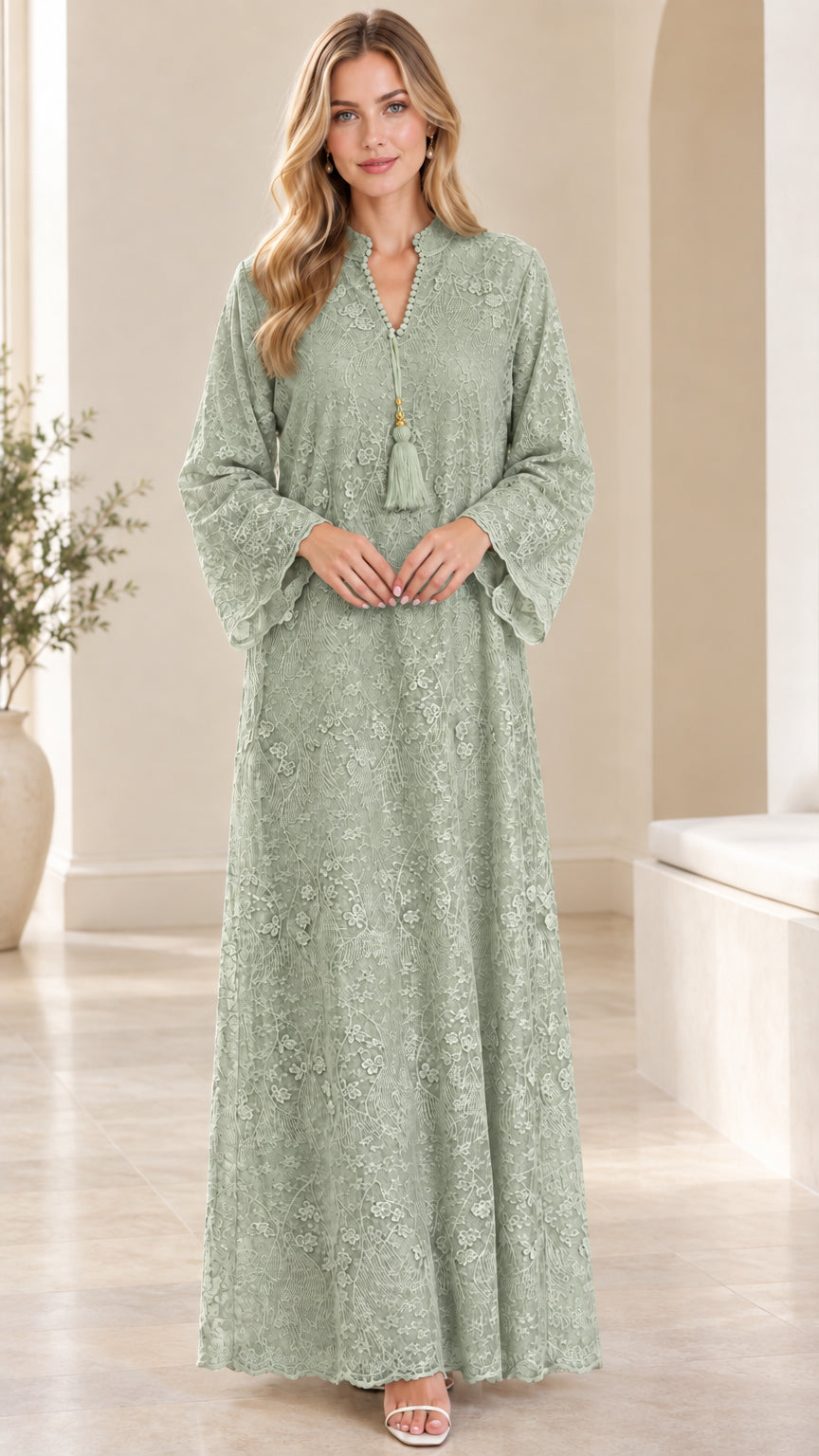 Front view of woman wearing sage green floral lace maxi dress with flared sleeves