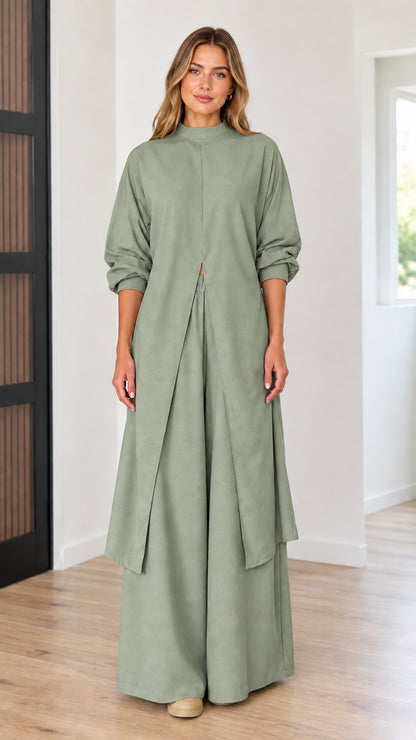 Full-length front view of model wearing sage green longline tunic top and wide-leg pants set