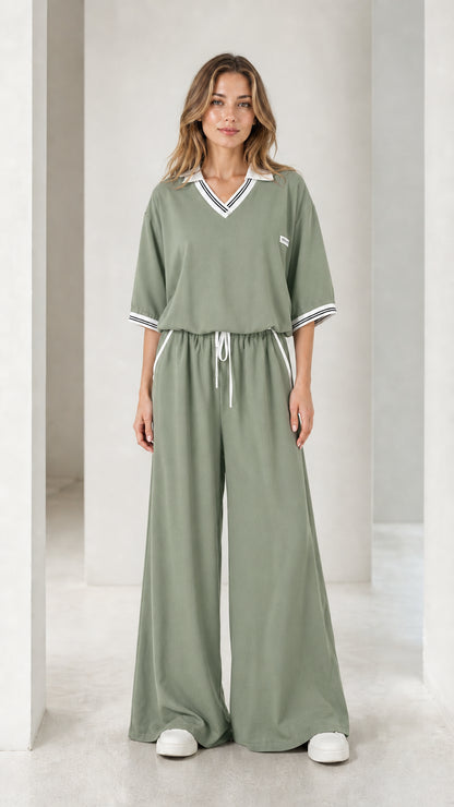 Front view of a sage green women's wide-leg jumpsuit with drawstring waist