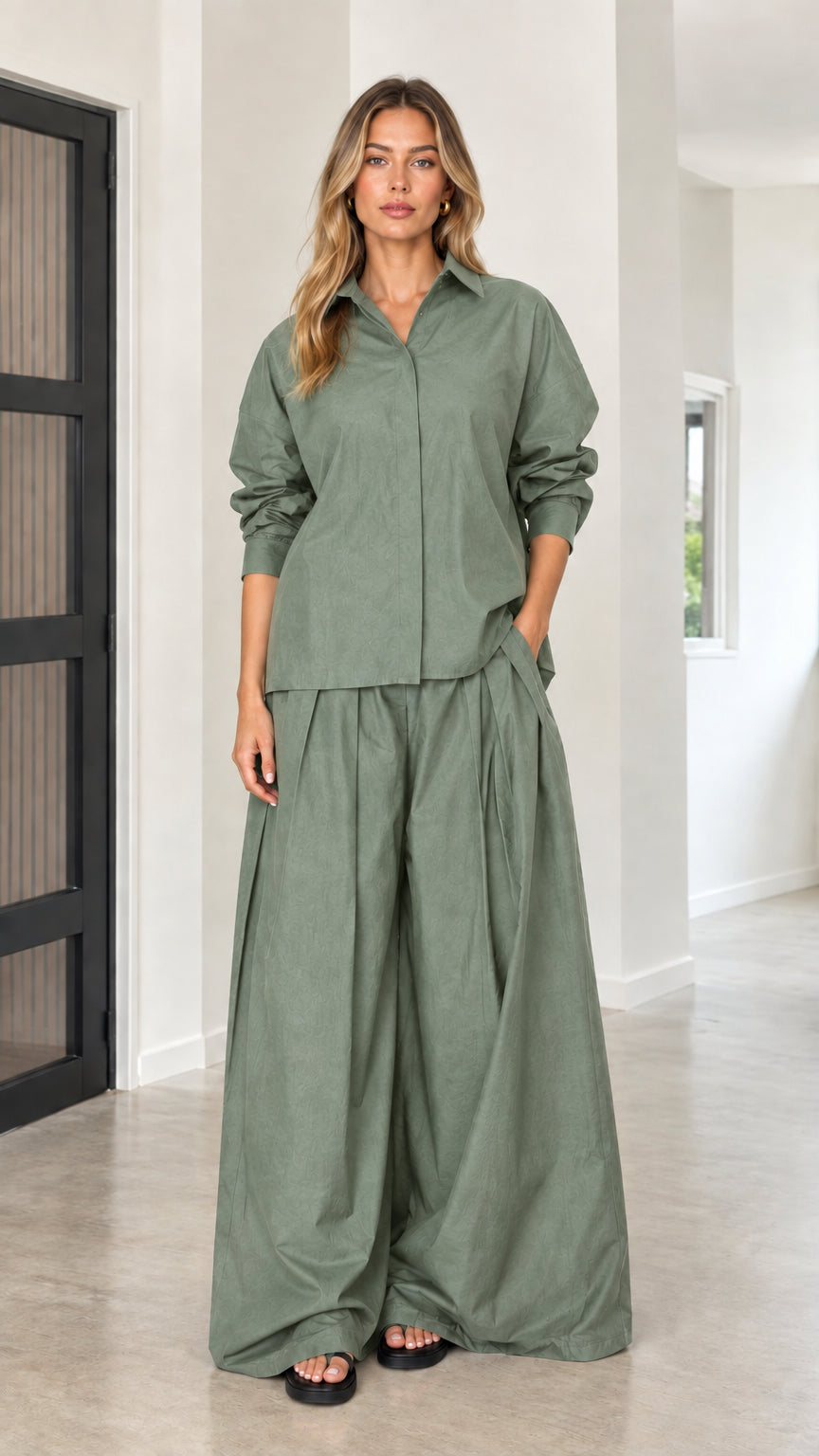Sage green two-piece outfit with collared long-sleeve top and voluminous palazzo pants