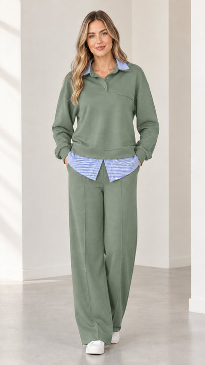 Full-body view of woman wearing sage green 2-piece layered collared sweat suit