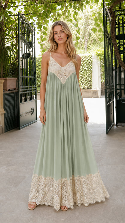 Front view of woman wearing sage green pleated maxi dress with contrast beige lace details