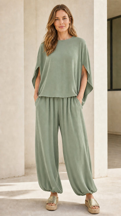 Woman wearing sage green matching two-piece lounge set