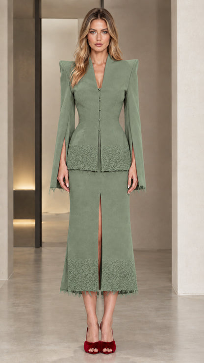 Front view of model wearing the sage green elegant skirt suit set