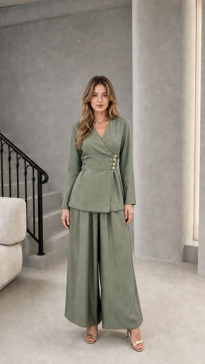 Model wearing sage green wrap blazer and wide leg pant set