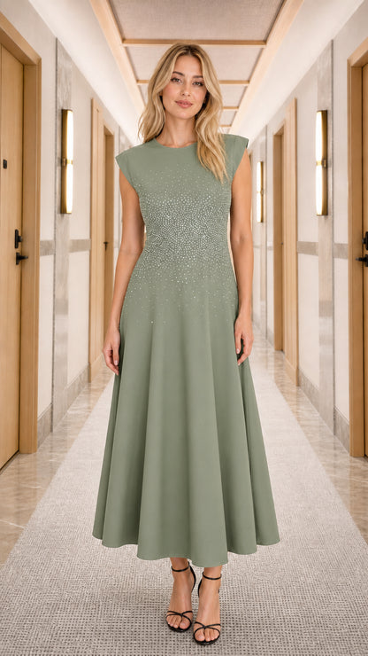 Woman wearing sage green rhinestone embellished cap sleeve midi dress