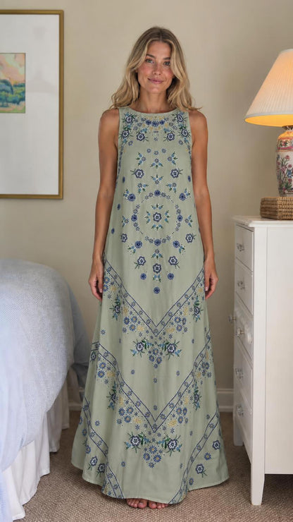 Front view of sage green floral embroidered maxi dress
