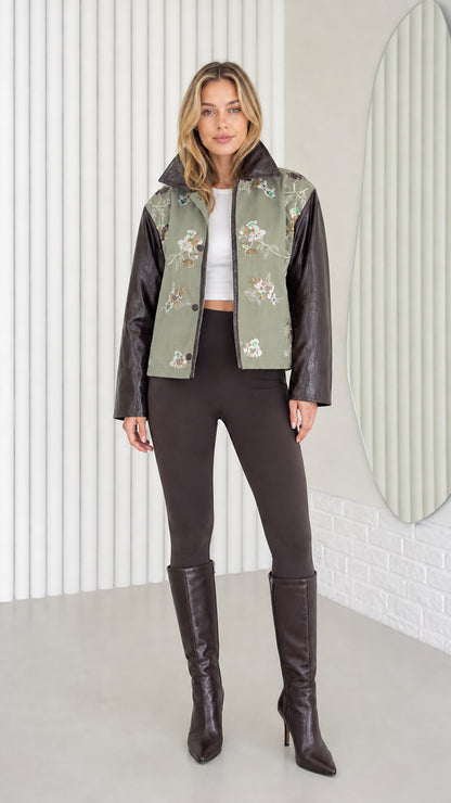 Model wearing Sage Green embroidered jacket with faux leather sleeves