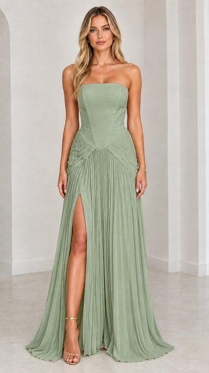 Model wearing sage green strapless pleated formal gown with slit
