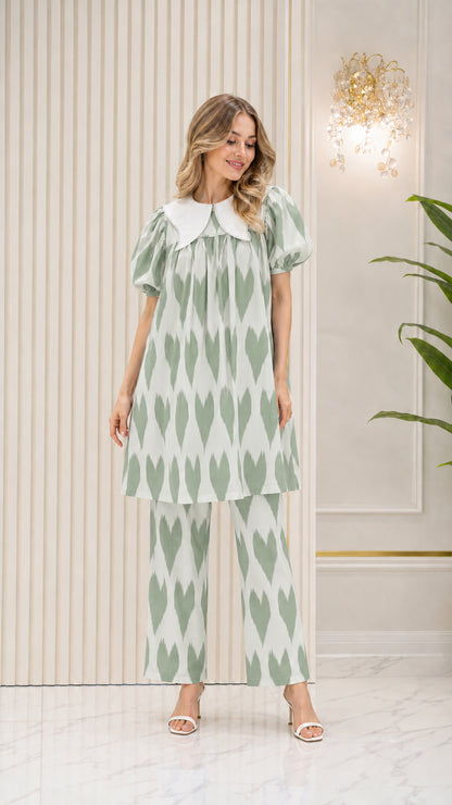 Model wearing Sage Green printed tunic and straight-leg pants set
