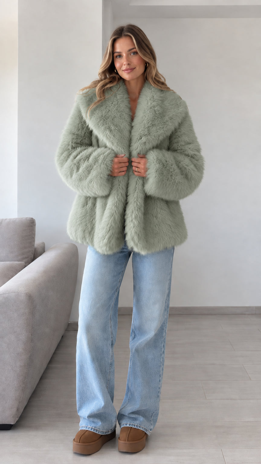 Front view of model wearing sage green plush faux fur lapel jacket