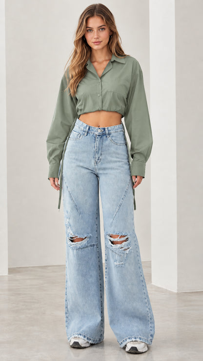 Front view of woman wearing sage green cropped button down shirt