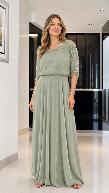 Model wearing sage green beaded pleated maxi dress
