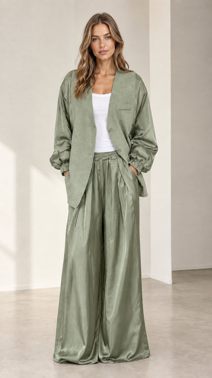 Front view of model wearing sage green contrast blazer and satin wide-leg pants set