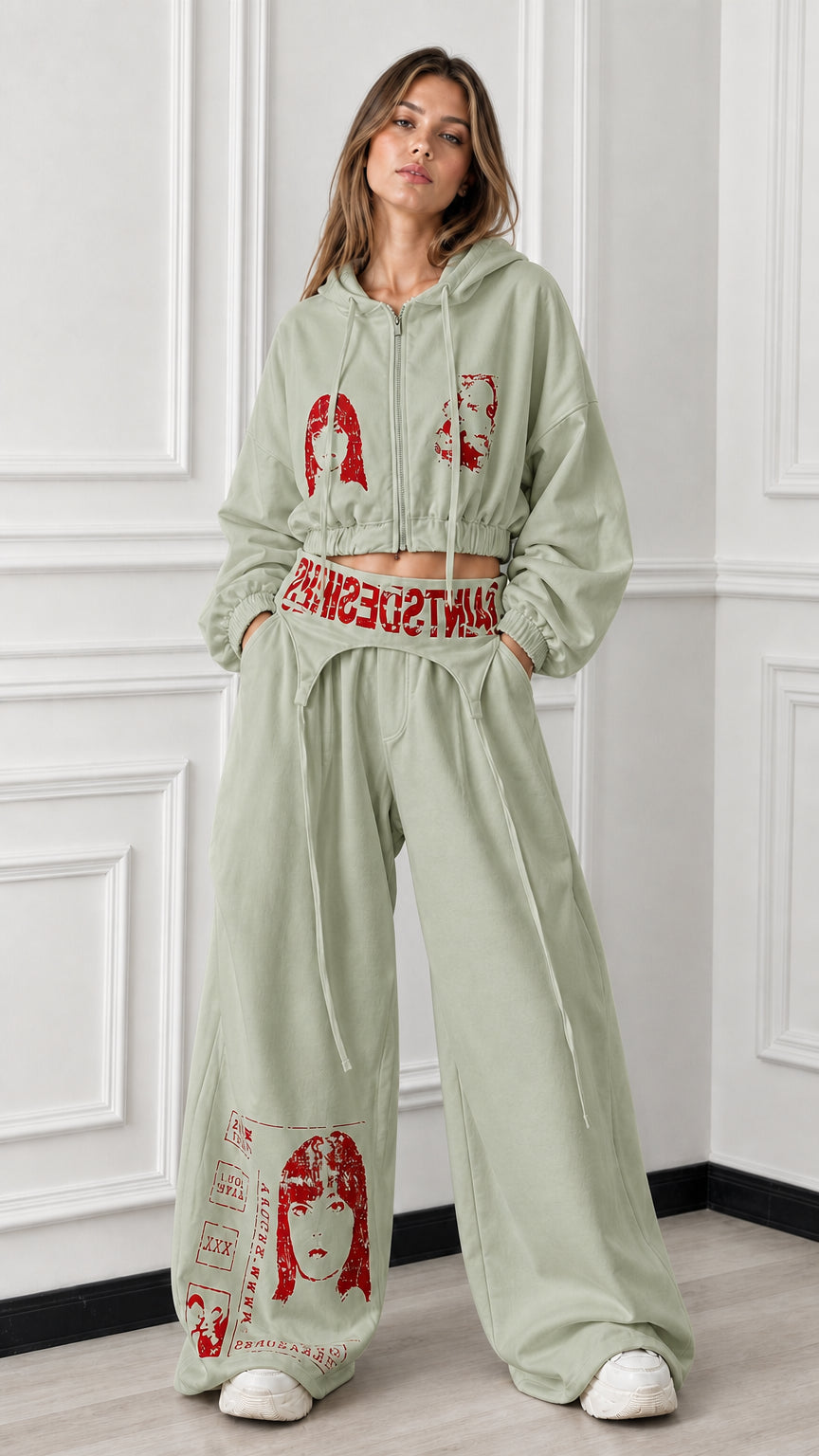 Full front view of sage green 2-piece cropped zip hoodie and wide-leg graphic sweatpants set