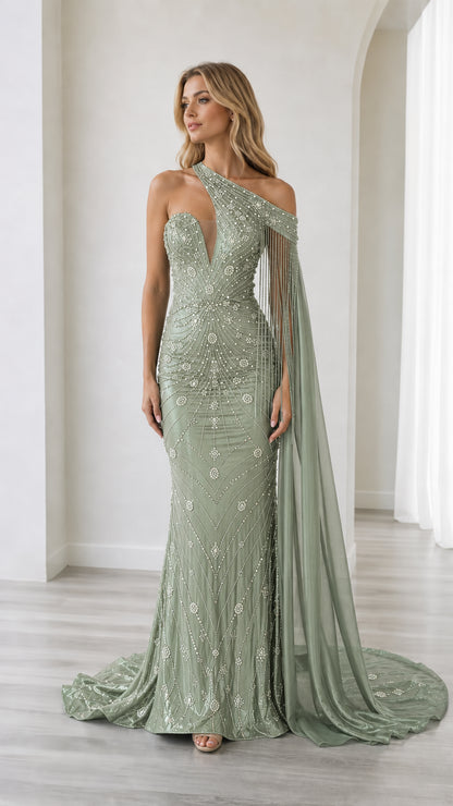 Front full-length view of the sage green beaded one-shoulder mermaid gown with long cape