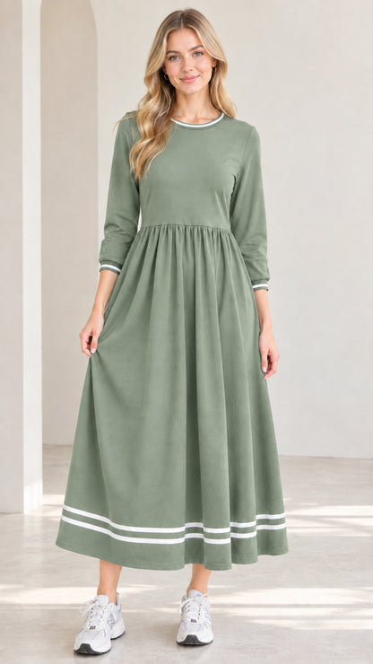 Front view of model wearing sage green 3/4 sleeve maxi dress with white striped trim