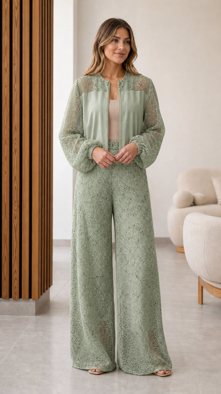 Model wearing sage green textured mesh panel zip jacket and wide leg pants set