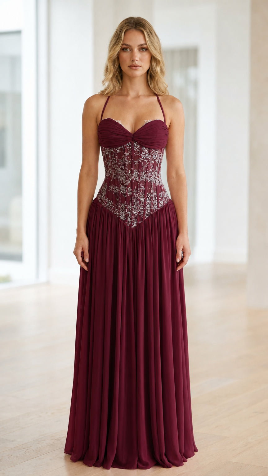 Front view of burgundy halter neck sequin corset long dress