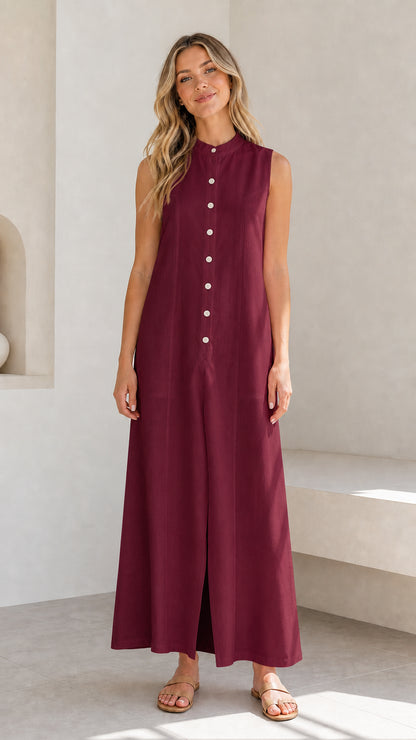 Full view of a woman wearing a burgundy sleeveless button-down maxi dress