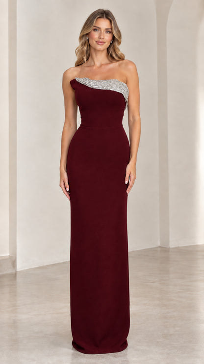 Front view of burgundy red strapless formal evening dress with rhinestone detailing