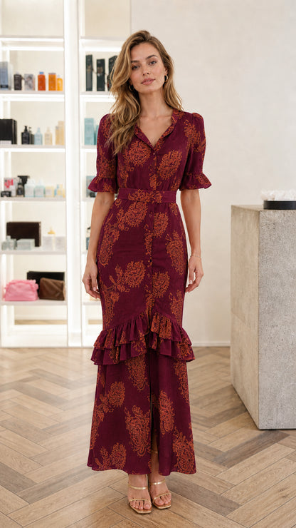Front view of woman wearing Burgundy wine paisley print belted maxi dress