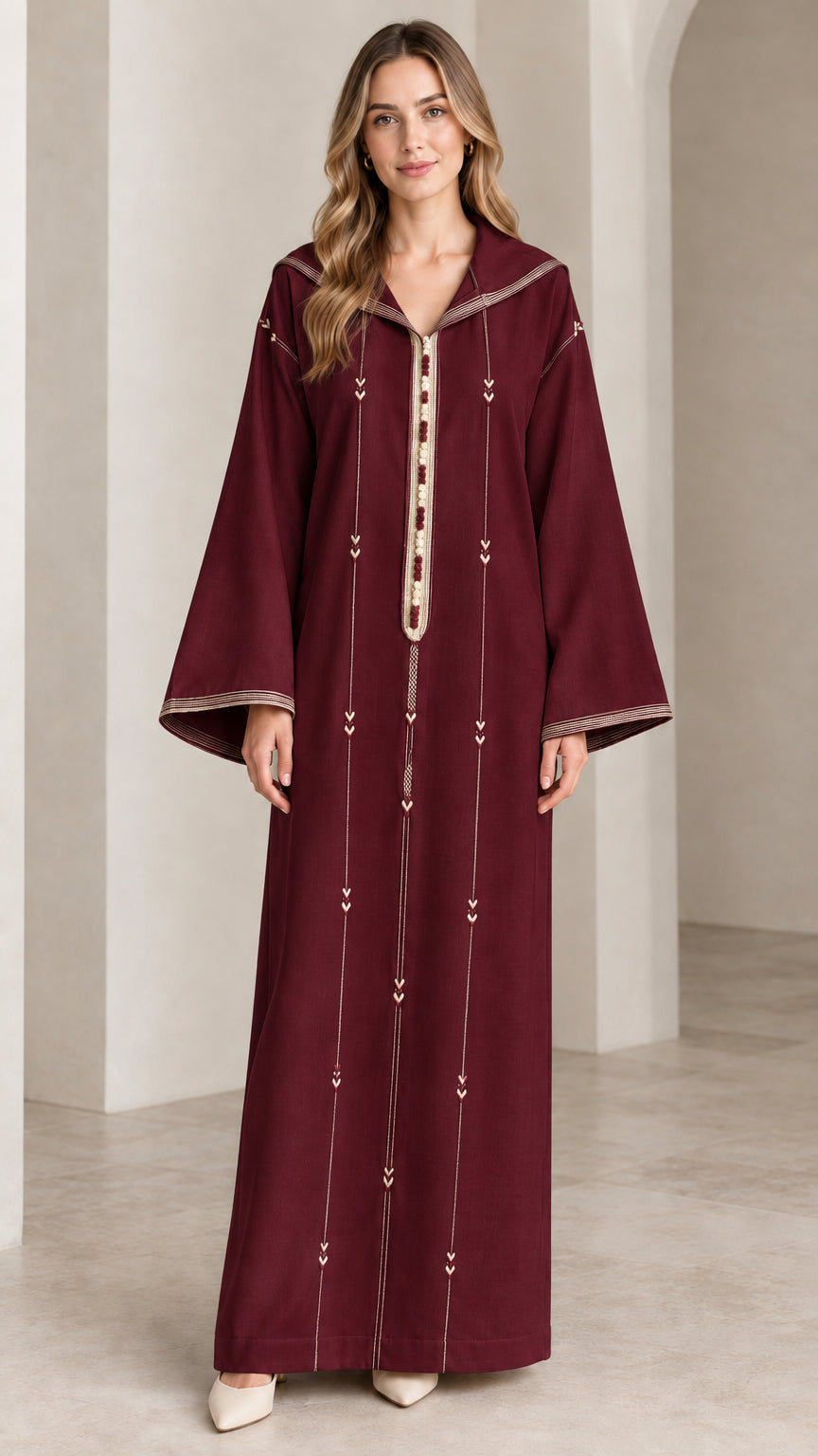 Front view of woman wearing burgundy wine hooded djellaba kaftan maxi dress