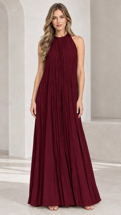 Front view of woman wearing Burgundy pleated halter maxi dress
