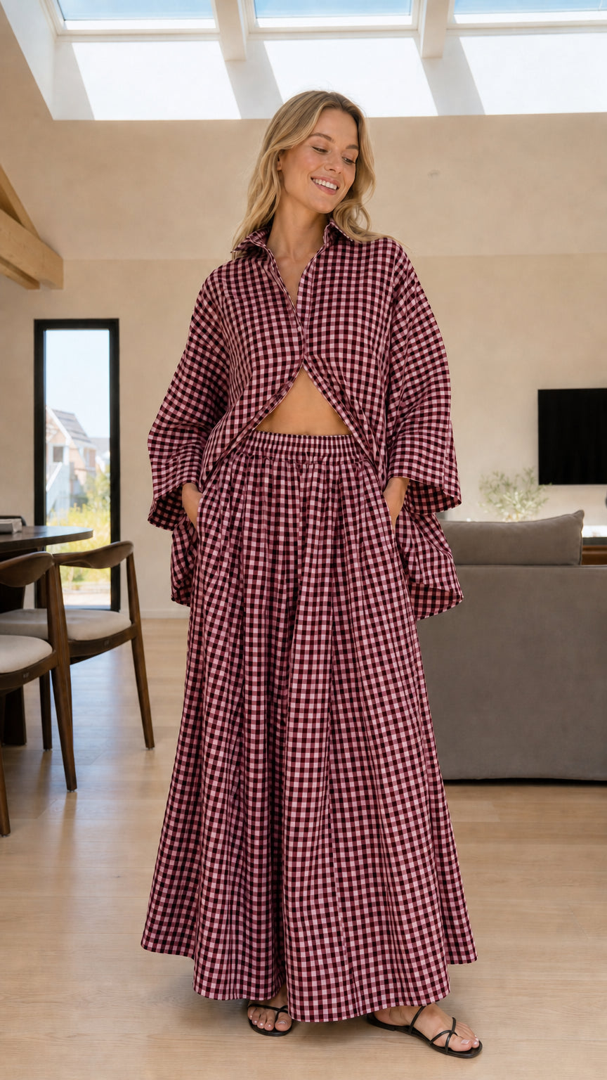 Woman wearing burgundy and white gingham check shirt and wide-leg pants set