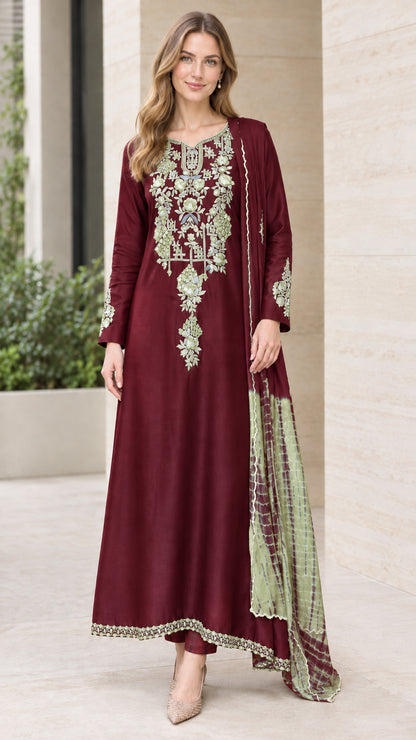 Front view of woman wearing Burgundy wine embroidered long kurta set with trousers