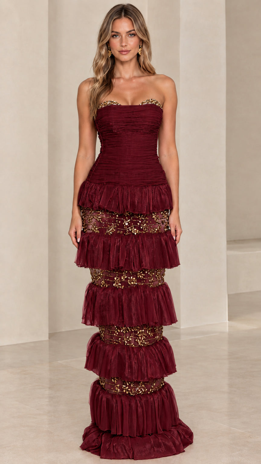 Front view of model wearing Burgundy wine red strapless tiered evening dress