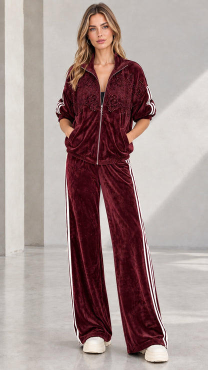 Full-length front view of woman wearing Burgundy embellished velvet tracksuit set