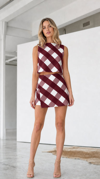 Model wearing burgundy checkered two-piece set