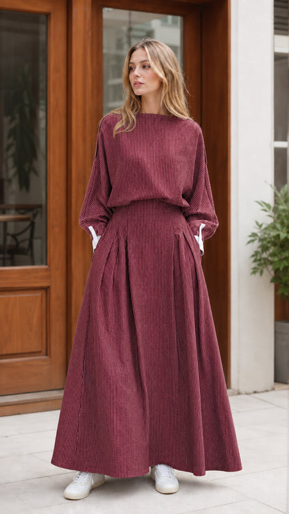 Model wearing burgundy red striped long sleeve maxi dress