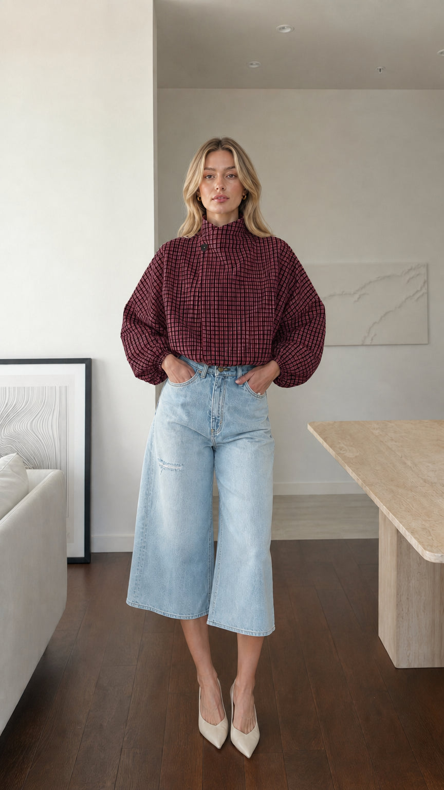 Model wearing burgundy plaid high-neck blouse