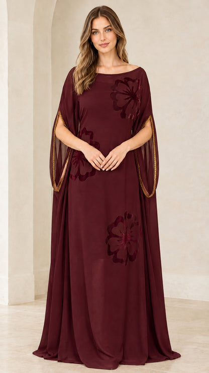 Front view of model wearing Burgundy wine red floral applique kaftan maxi gown