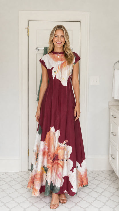 Front view of woman wearing burgundy wine watercolor floral A-line maxi dress