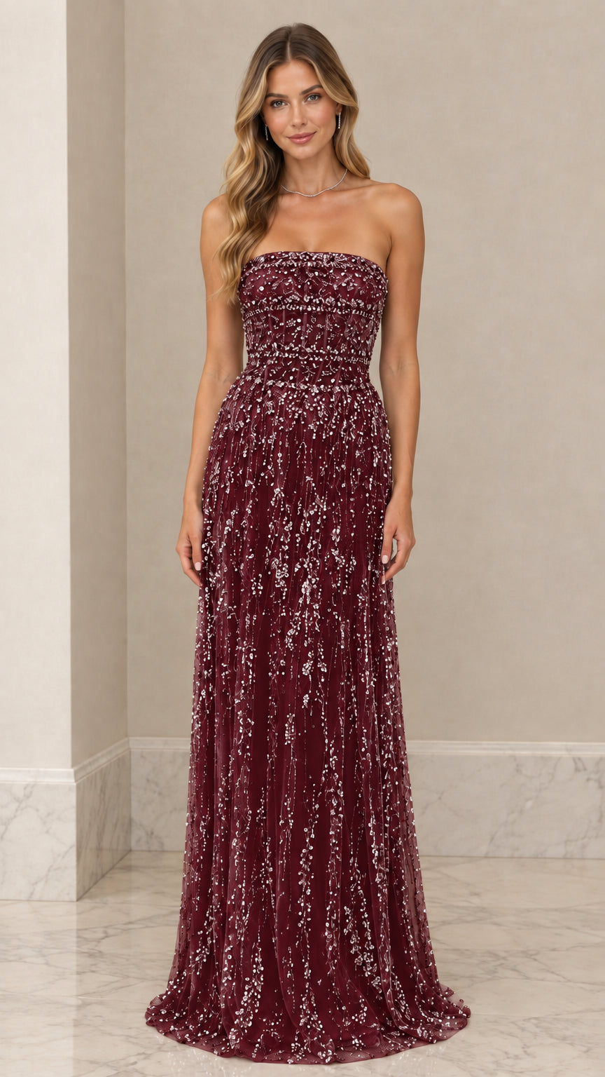 Front view of model wearing Burgundy wine strapless embellished maxi gown