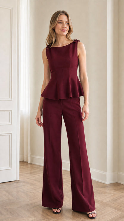 Model wearing burgundy wine red peplum top and matching wide-leg trousers set