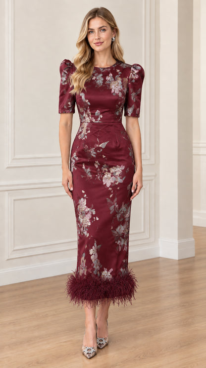 Front view of Burgundy wine floral jacquard midi dress with feather hem