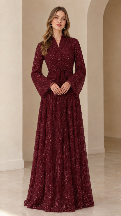 Front view of model wearing burgundy wine sequined long sleeve formal maxi dress